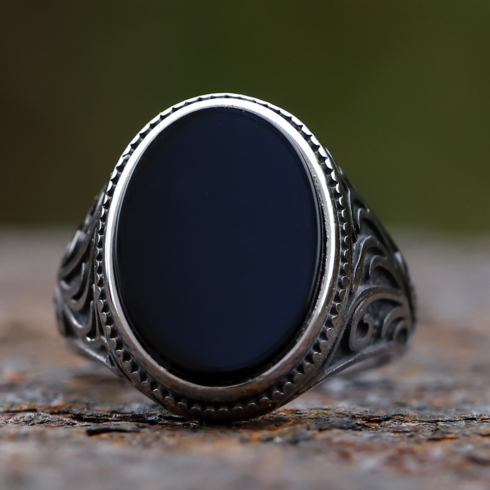 Side view of men's vintage silver ring highlighting the ornate scrollwork details