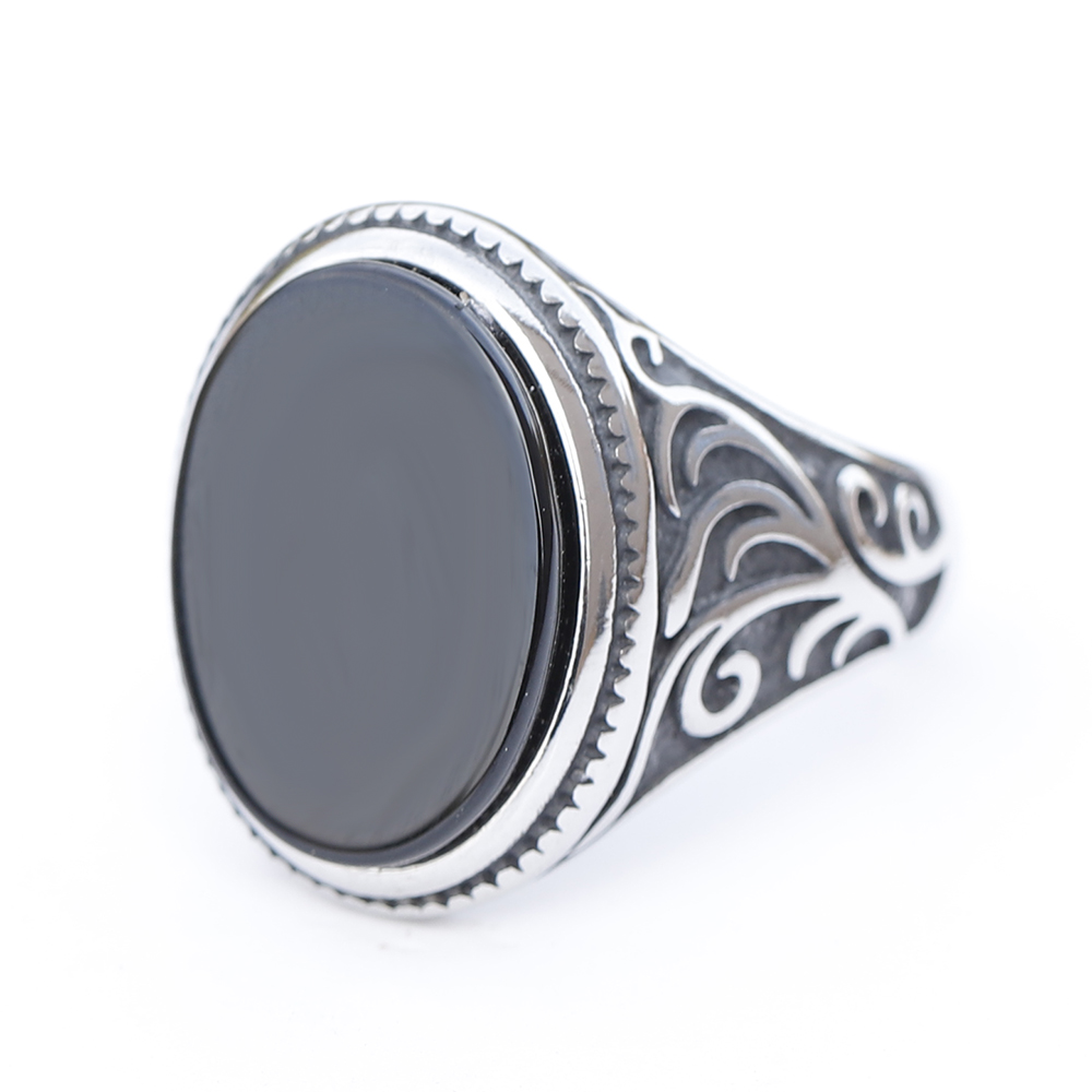 Angled view of the luxury men's ring revealing the full totem-inspired design and craftsmanship